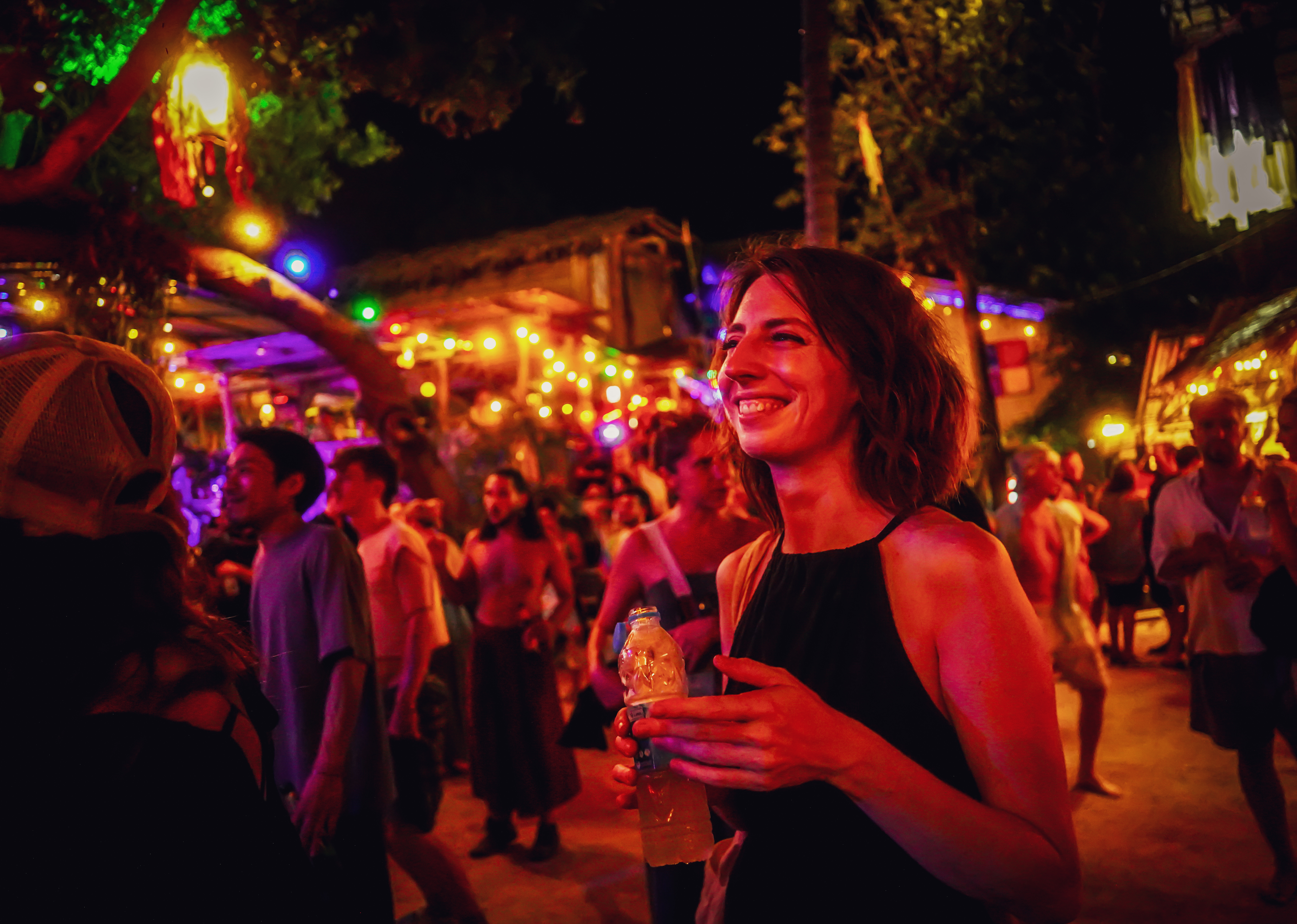 Smiling female guest enjoying the atmosphere at Rasta Home