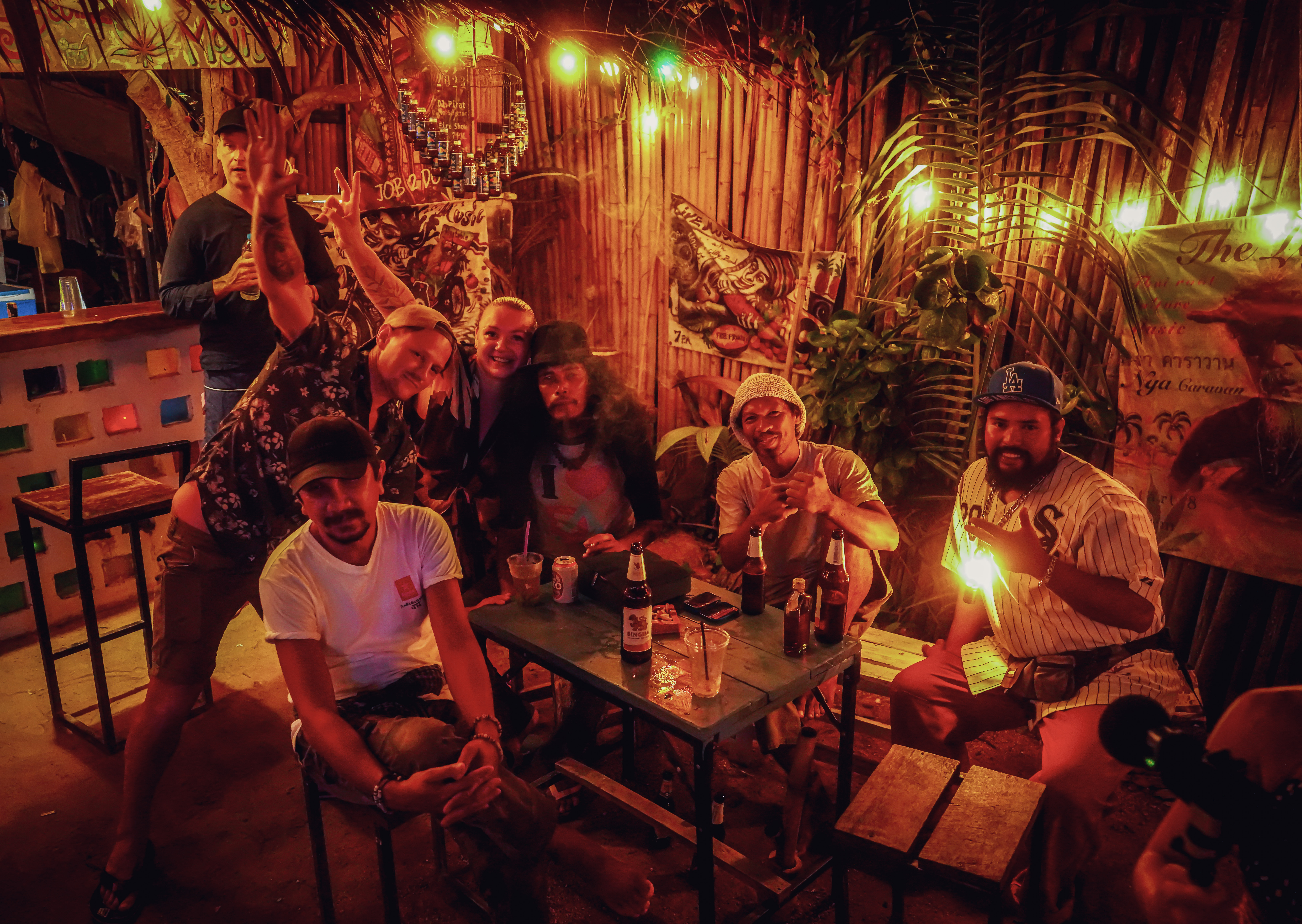 Guest sitting at the bamboo-style ground level bar.