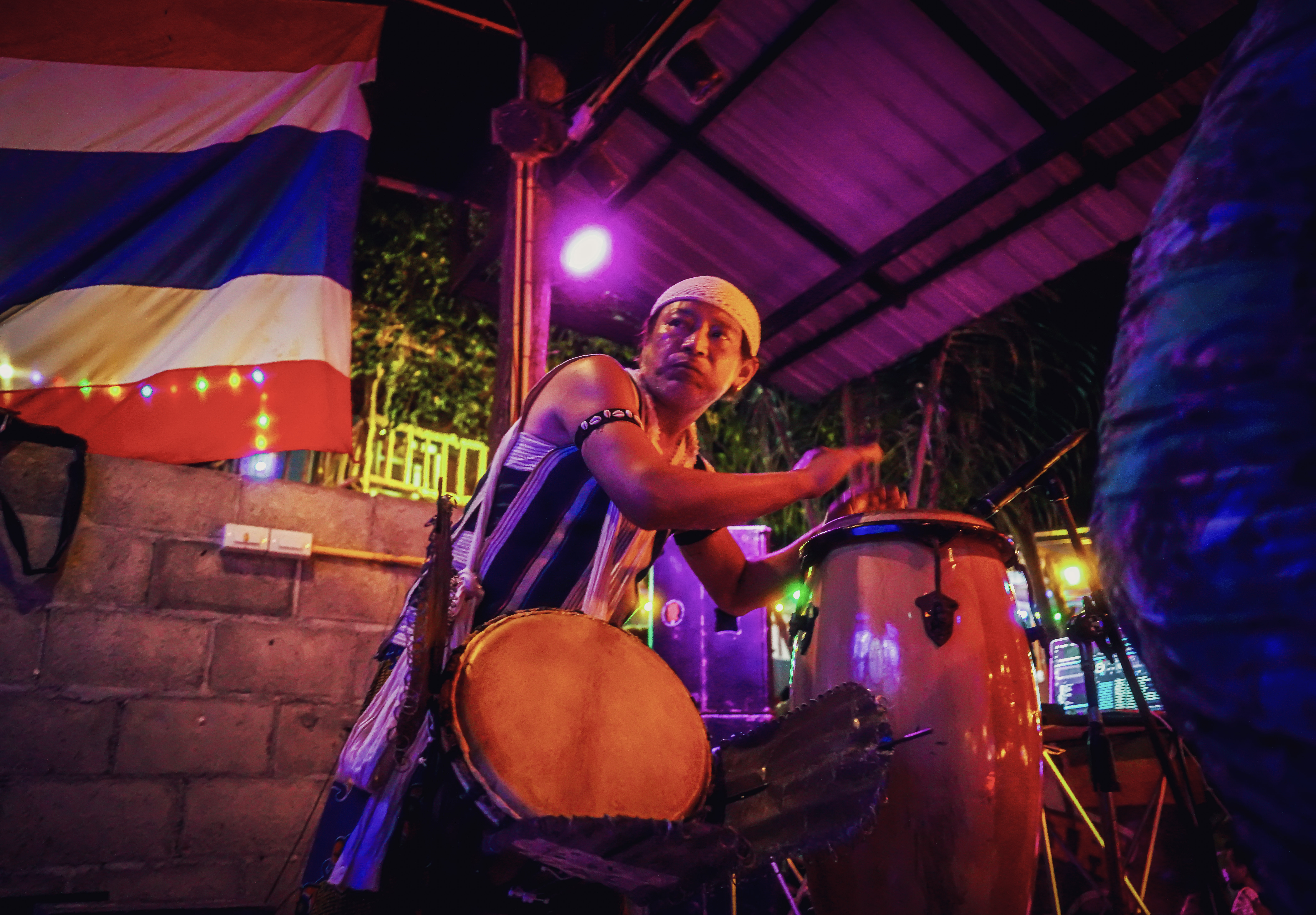 Drummer performing live at Rasta Home Bar