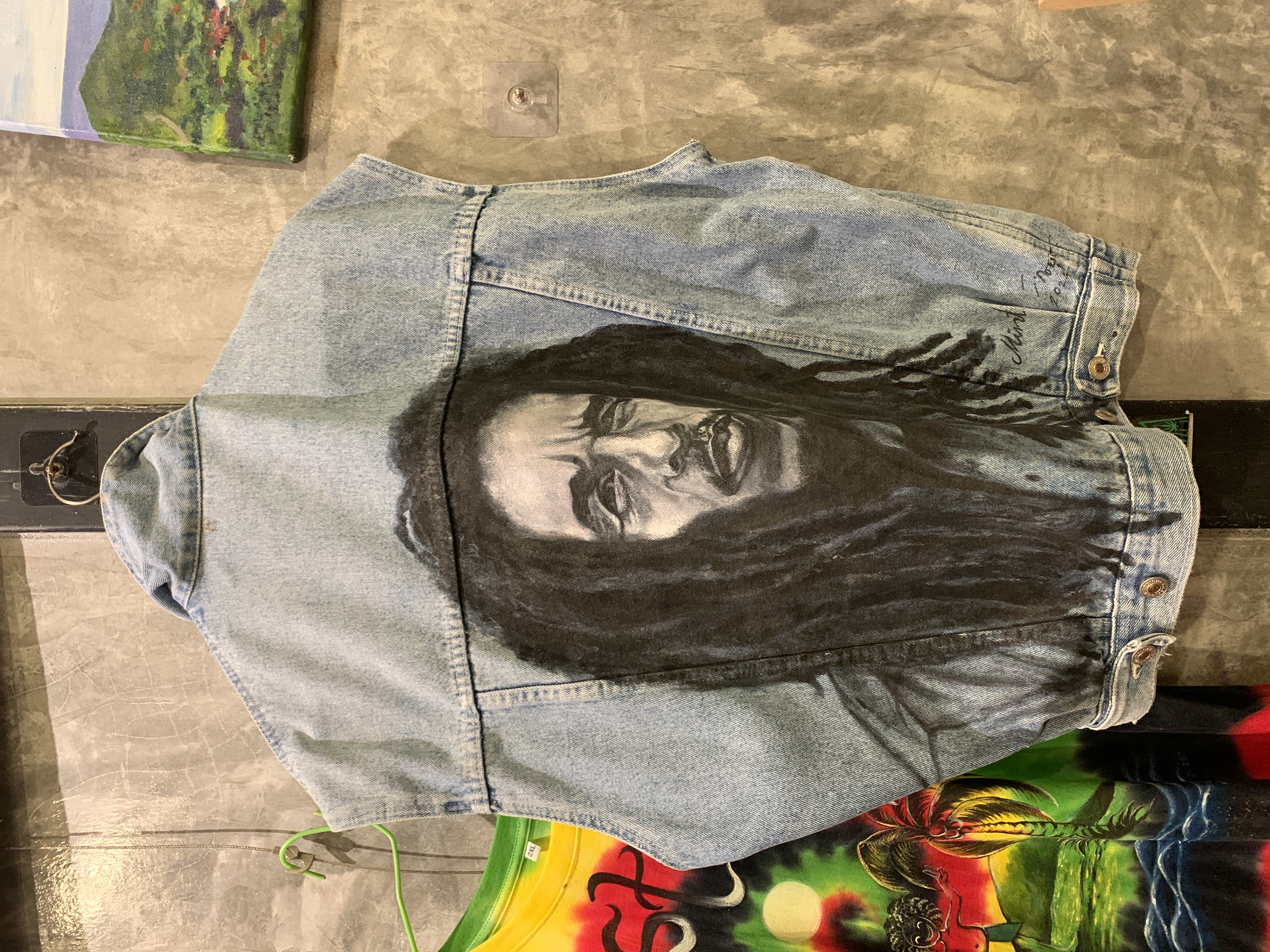 Hand-painted denim jacket featuring a portrait of Bob Marley.